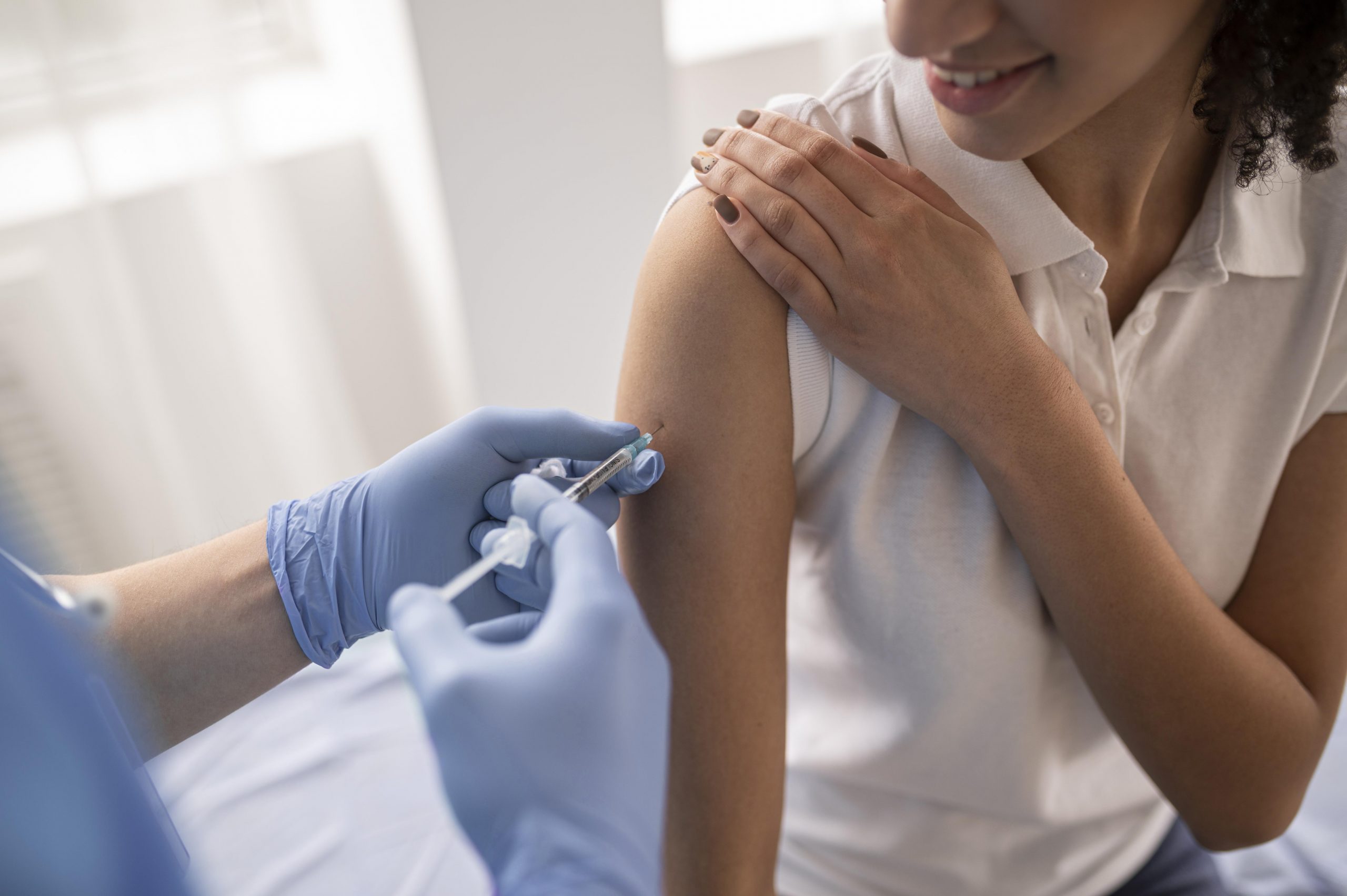 doctor-vaccinating-patient-in-clinic